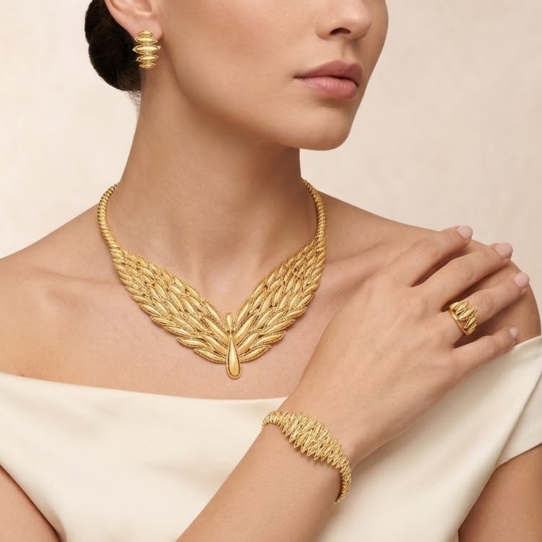 VIERTEILIGES GOLDSET MIT FLÜGELMOTIV
